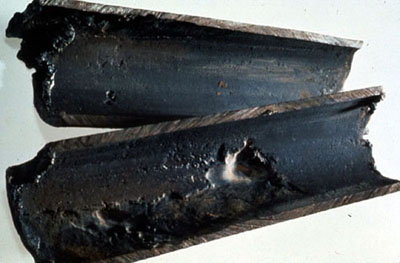 Figure 11-2. Boiler system tube shows high pH gouging.