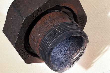 Figure 19-3. Section of condensate line destroyed by carbon dioxide (low pH) corrosion. Metal destruction is spread over a relatively wide area, resultingin thinning.