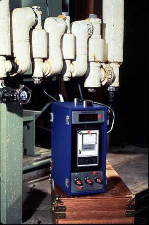 Figure 19-9. Test specimen bypass rack used to monitor amine treatment. The corrosion rate meter on the right measures relative corrosiveness instantaneously.
