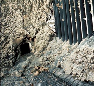 Figure 21-2. This far wall of a coal-burning boiler is heavy with slag composed primarily of aluminum silicates with some iron oxide.