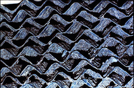 Figure 25-1. Scaling of cooling tower fill by a combination of calcium carbonate and calcium phosphate.